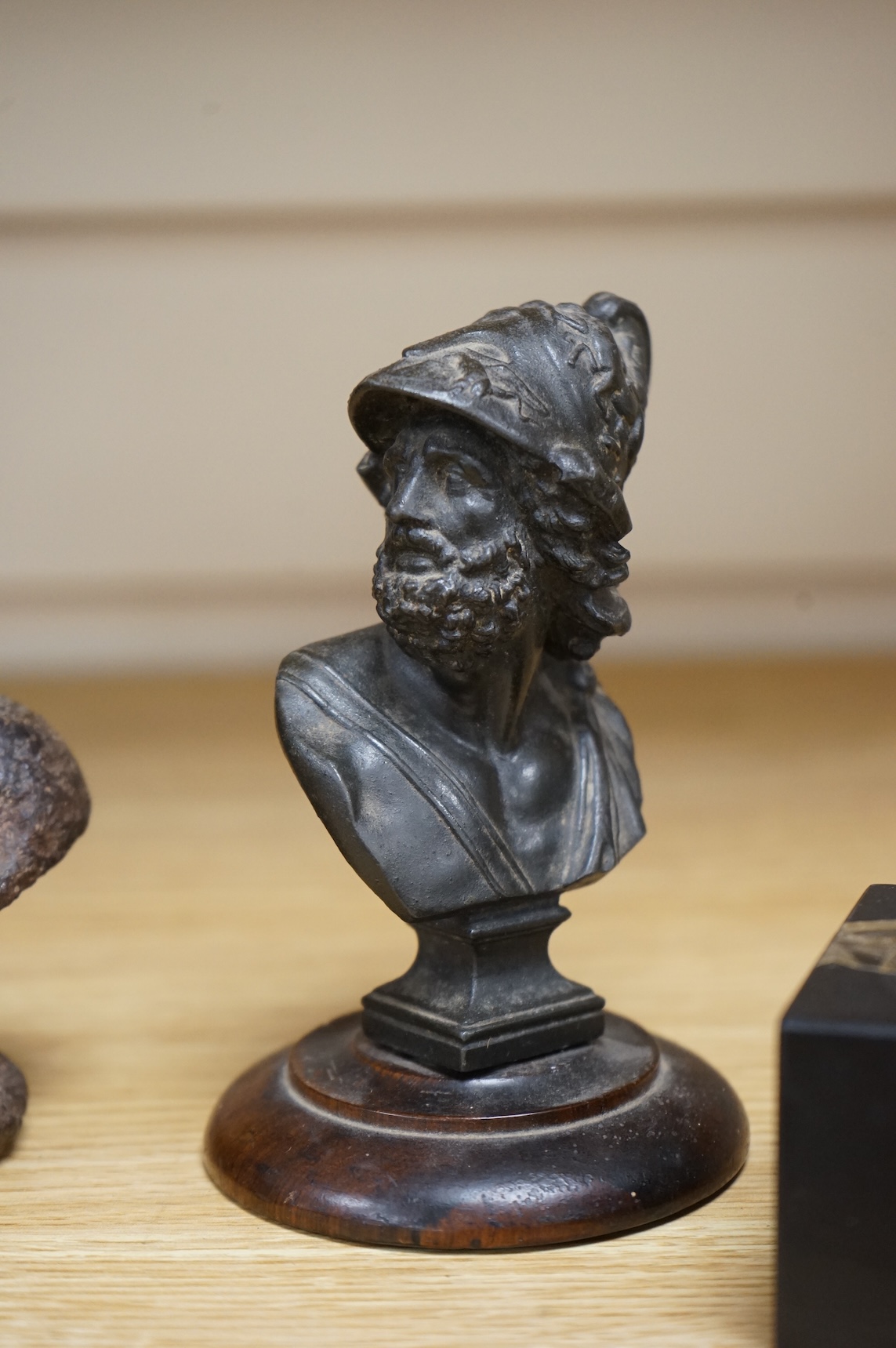 A bronze bust of Napoleon, a bust of Ajax and a cast iron bust of an Emperor, tallest 18cm